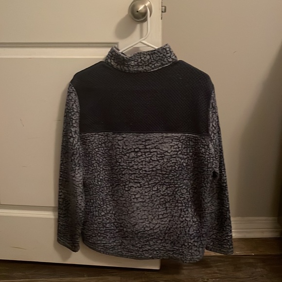 This is a furry navy blue with a little white athletic jacket! - Picture 2 of 3